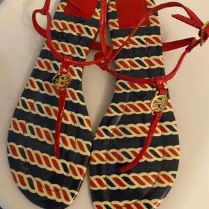 Women’s flat Tory Burch sandals. Pre owned but still looks good. Has dust bag